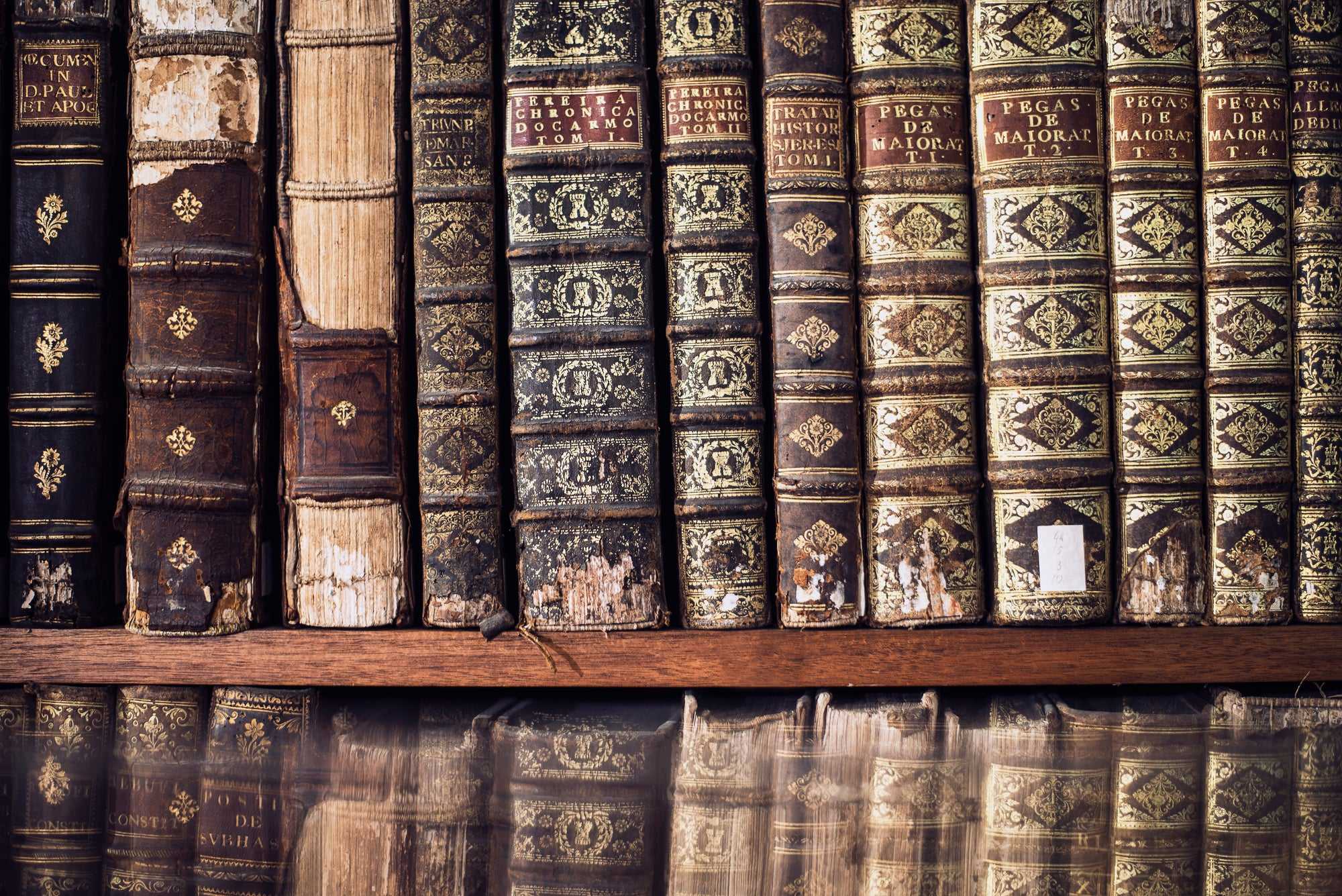 Antique books on a library shelf